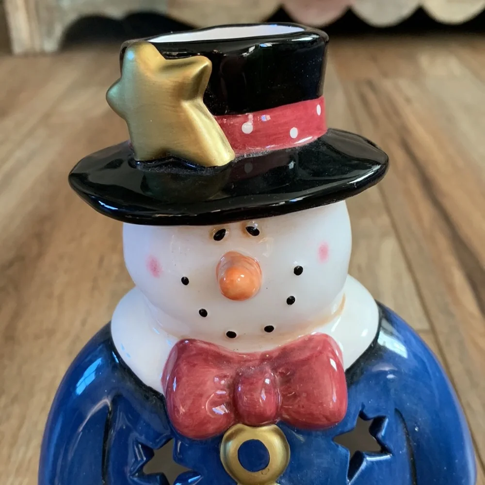 Snowman decor used as Christmas tree topper but think you can put light inside